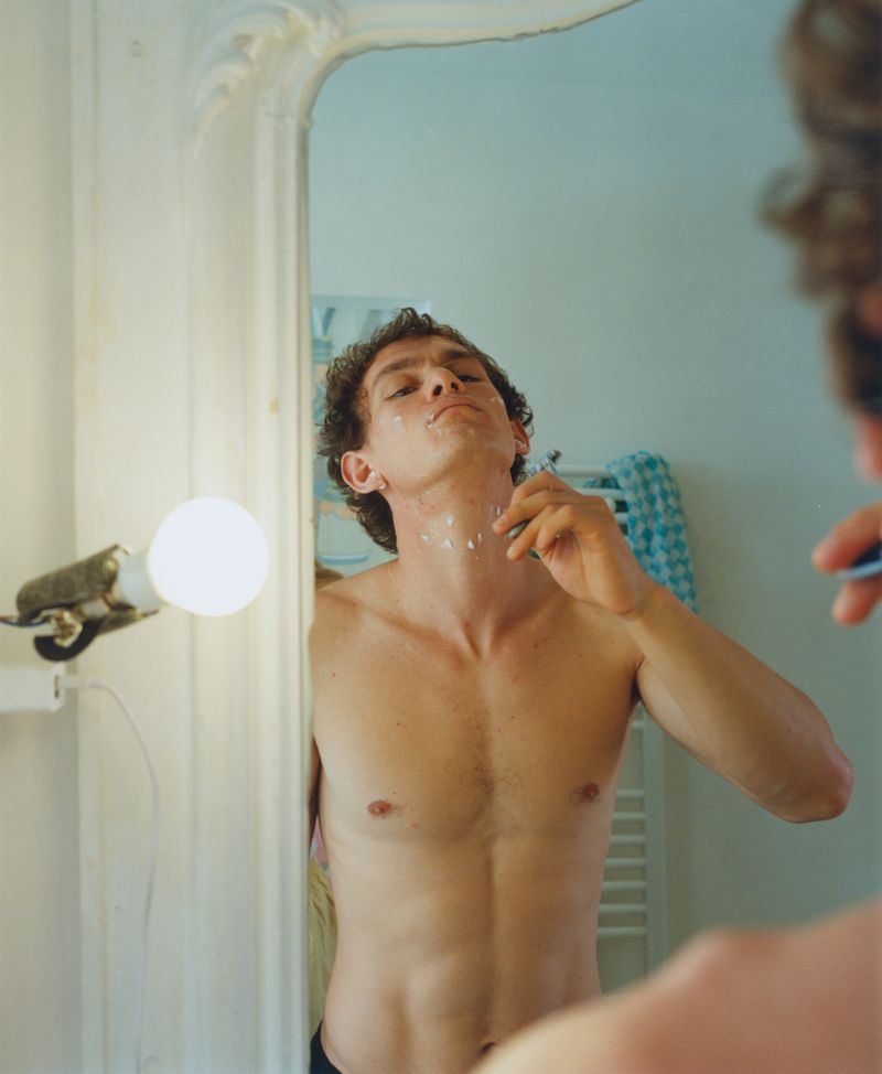 Man shaving in the mirror
